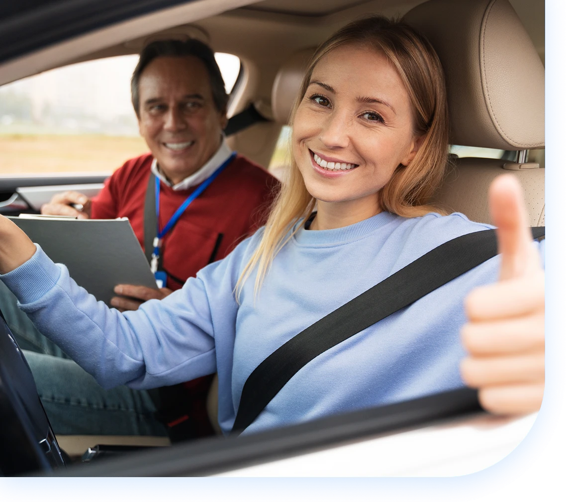girl giving thumbs up inside car1 girl coming out of car