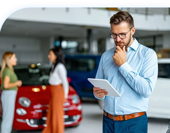 man deciding on buying car(mobile) man deciding on buying car